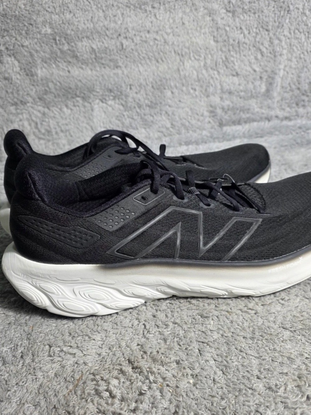 New Balance Men's Black Athletic Sneakers with White Sole